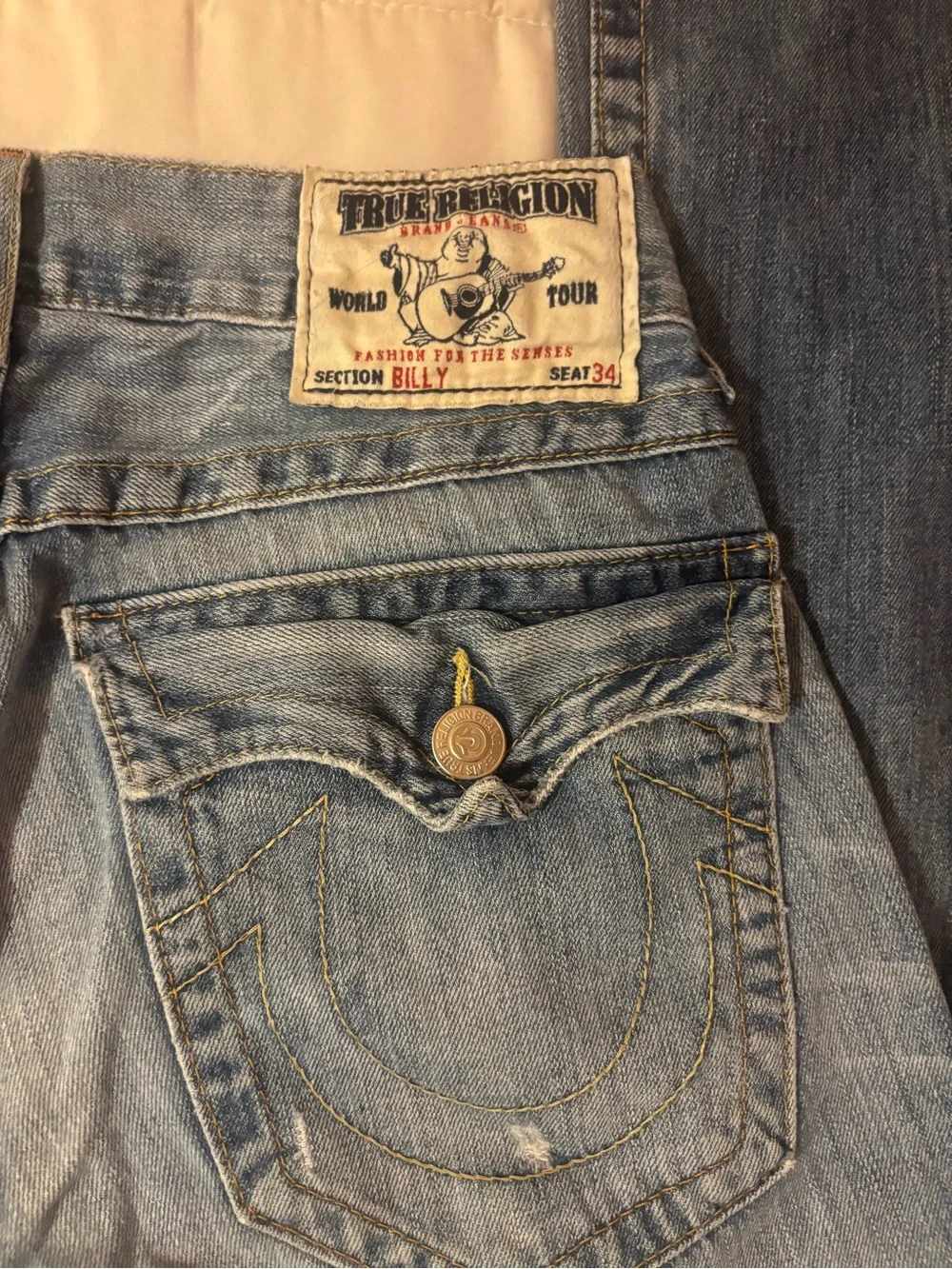 True Religion Women's Light Blue Flare Jeans with Distressed Knees